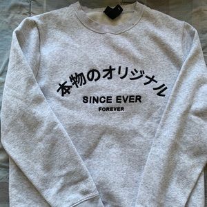 Sweater with Japanese text